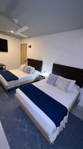 Postel nebo postele na pokoji v ubytování Star AV 37 HOTEL