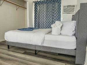 a bedroom with a bed and a window at Charming 2nd Ave Lofts in Downtown San Diego with Parking in San Diego