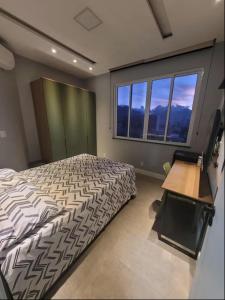 Postel nebo postele na pokoji v ubytování Espaço Maracanã