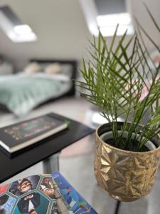 a plant in a vase sitting on a table at The Annexe rural retreat near Bath in Bath