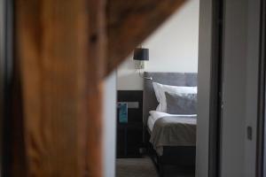 Postel nebo postele na pokoji v ubytování Michaelson Boutique Hotel & SPA Brícoła