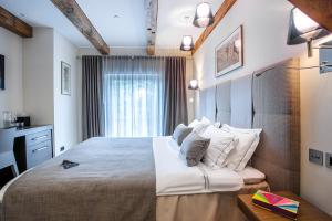 Postel nebo postele na pokoji v ubytování Michaelson Boutique Hotel & SPA Brícoła