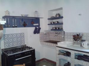 a kitchen with a stove and a counter top at les-cles-de-saint-pierre in Visan