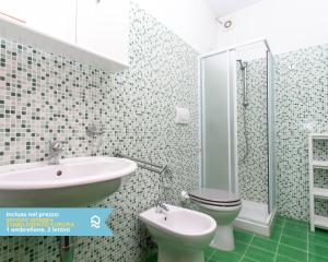 a bathroom with a sink and a toilet at RS316 - Marcelli, bilocale in residence fronte mare pt in Marcelli +13 photos