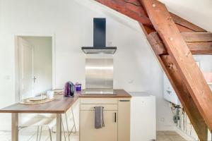 Η κουζίνα ή μικρή κουζίνα στο Le charmant - T3 - Montluel