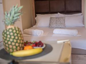 Ένα ή περισσότερα κρεβάτια σε δωμάτιο στο Palma Rooms & Suites Budva +49 φωτογραφίες