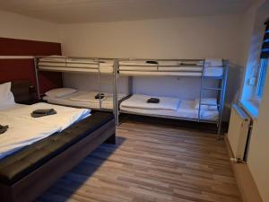 Postel nebo postele na pokoji v ubytování Hotel Garni Krone
