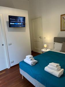 Postel nebo postele na pokoji v ubytování Cavour 142 Rooms
