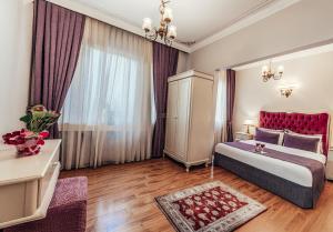 Postel nebo postele na pokoji v ubytování Olive Garden Apart