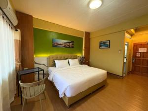 Postel nebo postele na pokoji v ubytování BanPunmanus Hotel