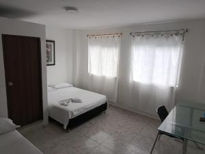 Uma cama ou camas num quarto em Hotel Bayadera Real