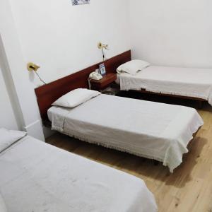 Postel nebo postele na pokoji v ubytování Residencial Ski
