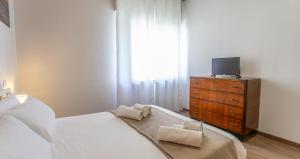 Postel nebo postele na pokoji v ubytování 5 Min dal Mare Centro Wi-fi & Balcone
