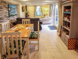 a kitchen and living room with a table and chairs at Sunnyside in Barrow upon Humber