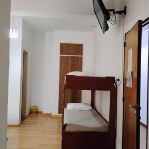 Postel nebo postele na pokoji v ubytování Residencial Ski