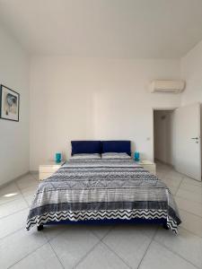 Ένα ή περισσότερα κρεβάτια σε δωμάτιο στο Apartment in Marina Piccola