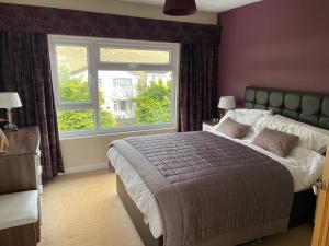 Ένα ή περισσότερα κρεβάτια σε δωμάτιο στο Ambleside 3 Bedroom Apartment