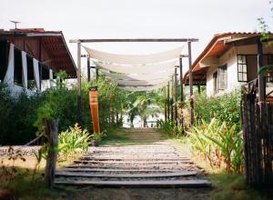 a path with a white canopy over a house at Casa Morrillo in Morrillo