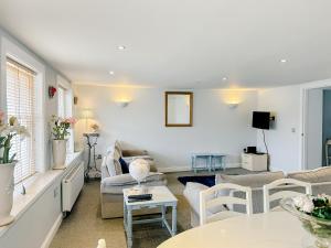 a living room with a couch and a table at Town Centre Apartment in Berwick-Upon-Tweed