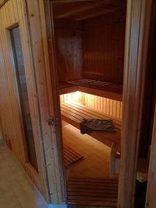 an inside view of a sauna with the light on at Lenangsvegen 2929 in Russelv +11 photos