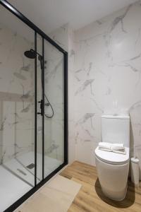 Koupelna v ubytování Lôla Suites by Concept Flats