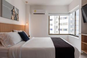 Кровать или кровати в номере Apartamento en Bocagrande - Piscina, Jacuzzi y Mar +39 фотографий