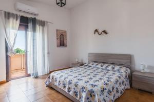 Postel nebo postele na pokoji v ubytování Terrazza Namastè