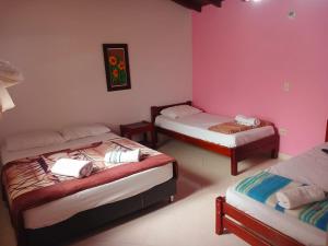 Letto o letti in una camera di Hotel Lagos de Guatape