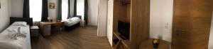Hotel am Wasserturmにあるベッド