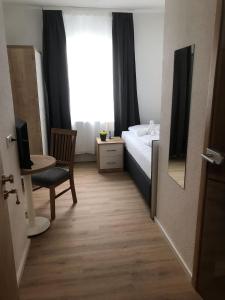 Hotel am Wasserturmにあるベッド
