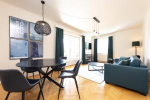a living room with a table and a couch at Parkvilla 11 in Fürstenfeld