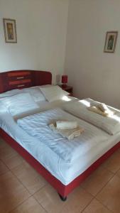 Posteľ alebo postele v izbe v ubytovaní Mediterrán Apartman és Vendégház