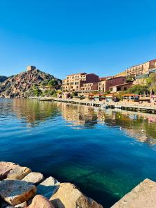 a large body of water with buildings in the background at CASA BIANCA MAISON BLANCHE in Saint-Florent