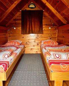 Postel nebo postele na pokoji v ubytování Small Bungalow - Tara Place