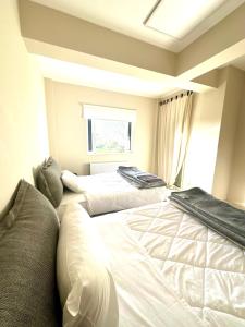 A bed or beds in a room at Grand Afroditi LUX