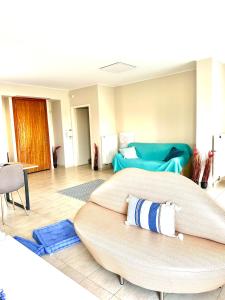 A bed or beds in a room at Grand Afroditi LUX