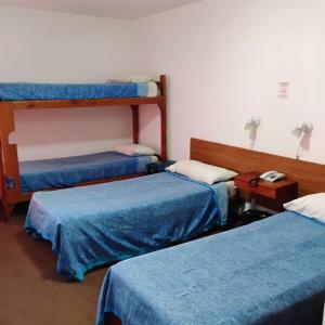 Postel nebo postele na pokoji v ubytování Residencial Ski