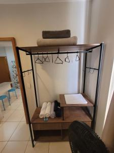 a shelf with towels on it in a room at Samambaia East Side · Comfort in Samambaia in Brasilia +44 photos
