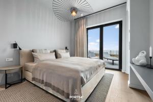 Rúm í herbergi á Waterfront Suite List auf Sylt