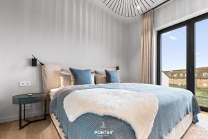 Rúm í herbergi á Haven Suite List auf Sylt