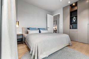 Rúm í herbergi á Haven Suite List auf Sylt