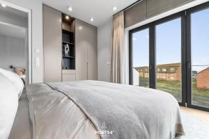Rúm í herbergi á Haven Suite List auf Sylt