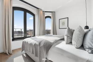 Postel nebo postele na pokoji v ubytování Times Square Penthouse List auf Sylt