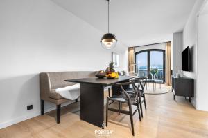 TV a/nebo společenská místnost v ubytování Turtle Bay Suite List auf Sylt
