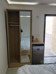 A bed or beds in a room at Pyramids House inn