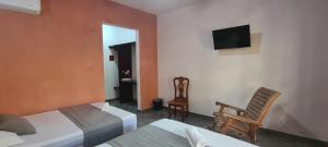 TV in/ali zabaviščno središče v nastanitvi Hotel Rosa de los vientos