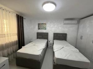 Ένα ή περισσότερα κρεβάτια σε δωμάτιο στο Vila flavjo