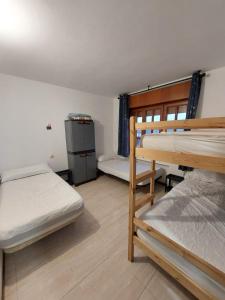 Postel nebo postele na pokoji v ubytování Albergue La Costana