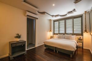 Postel nebo postele na pokoji v ubytování Hotel Monaguillo de Getsemaní