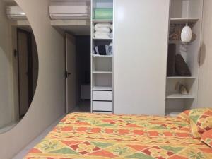 a bedroom with a bed and a closet at FLAT MONTE CASTELO - Flat10 Mod04 in Sairé +11 photos